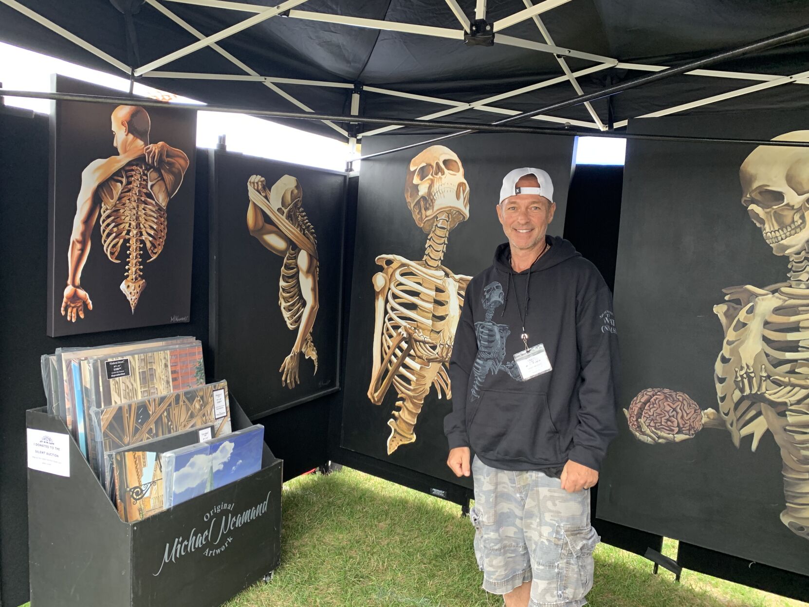 Michael Neamand displays his painting series at Art in the Park